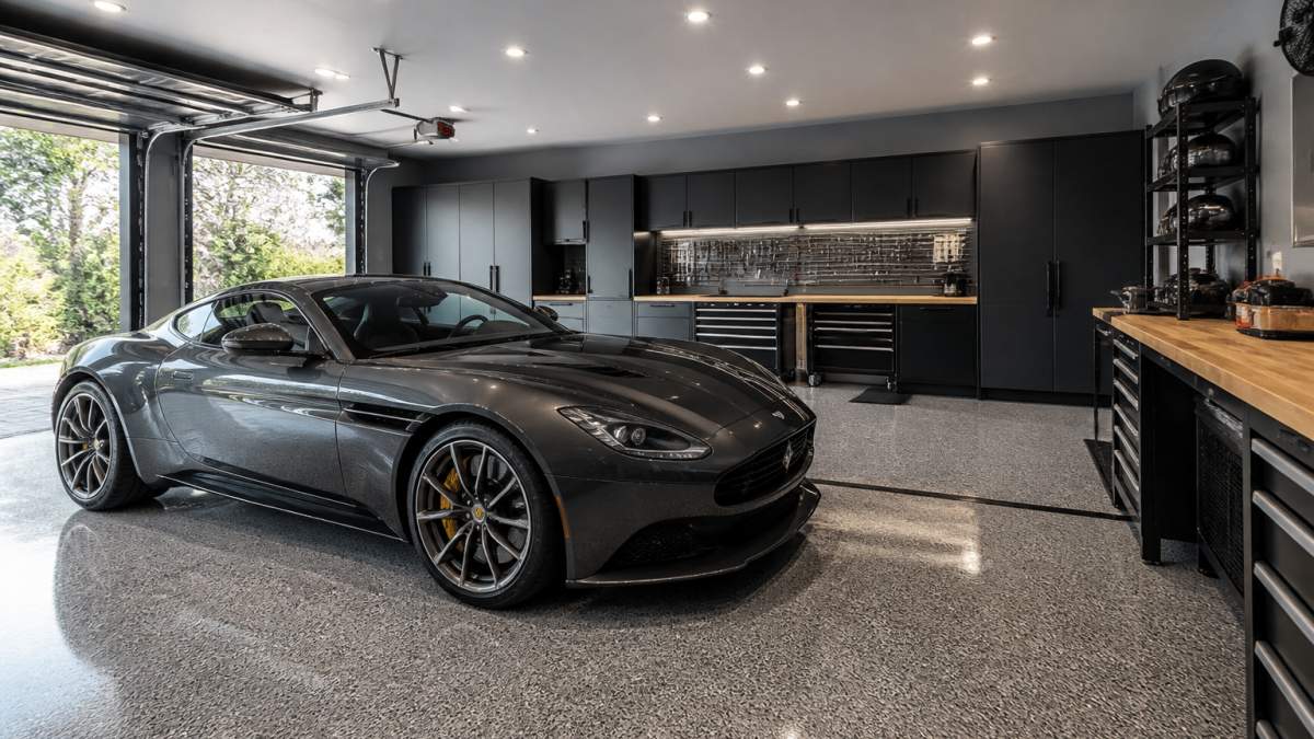 Luxury sports car in a garage showroom and workshop design with epoxy floors and organized tool storage.